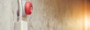 close up of fire alarm bell on wall in an industrial building